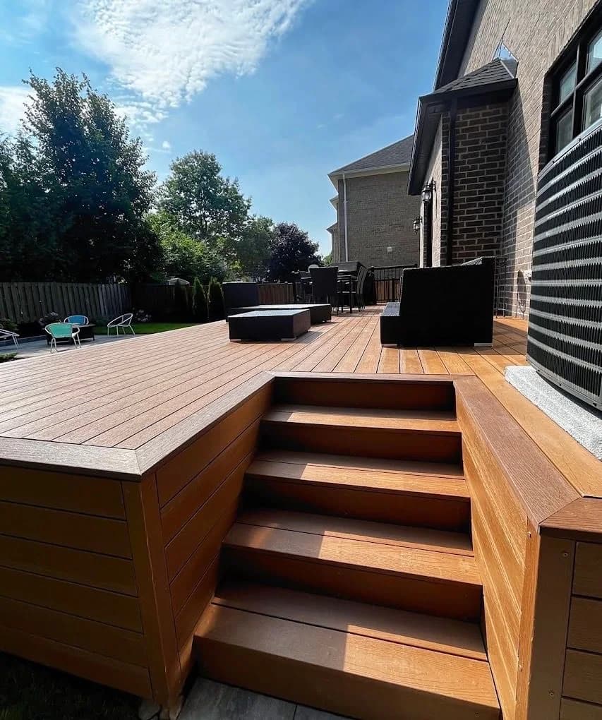 Warm composite deck with integrated steps and outdoor seating