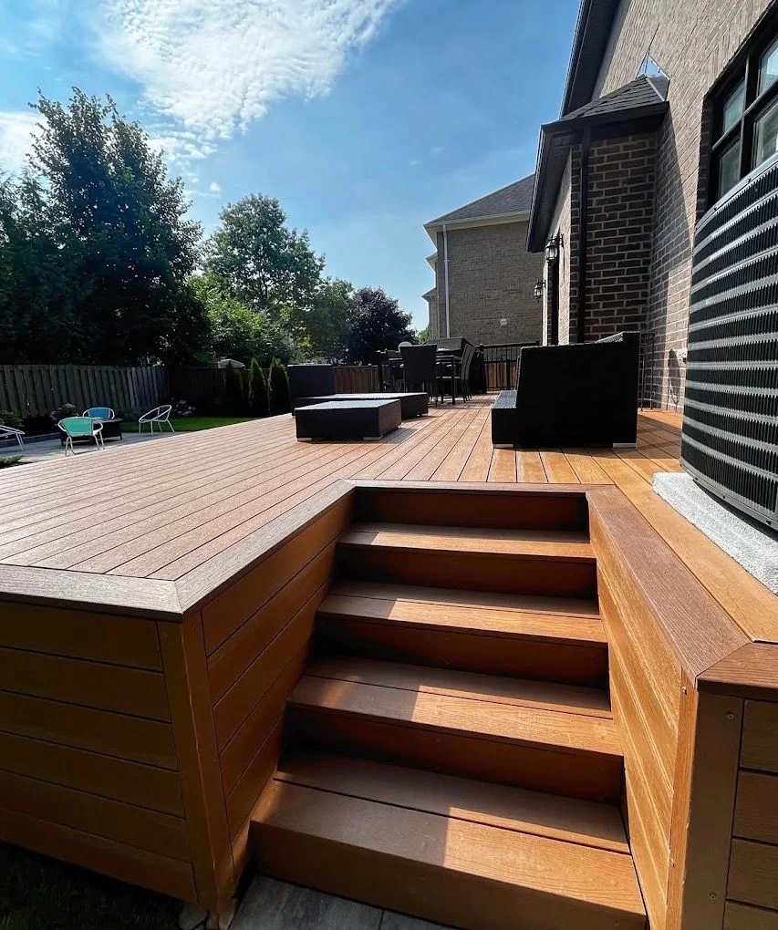 Warm composite deck with integrated steps and outdoor seating