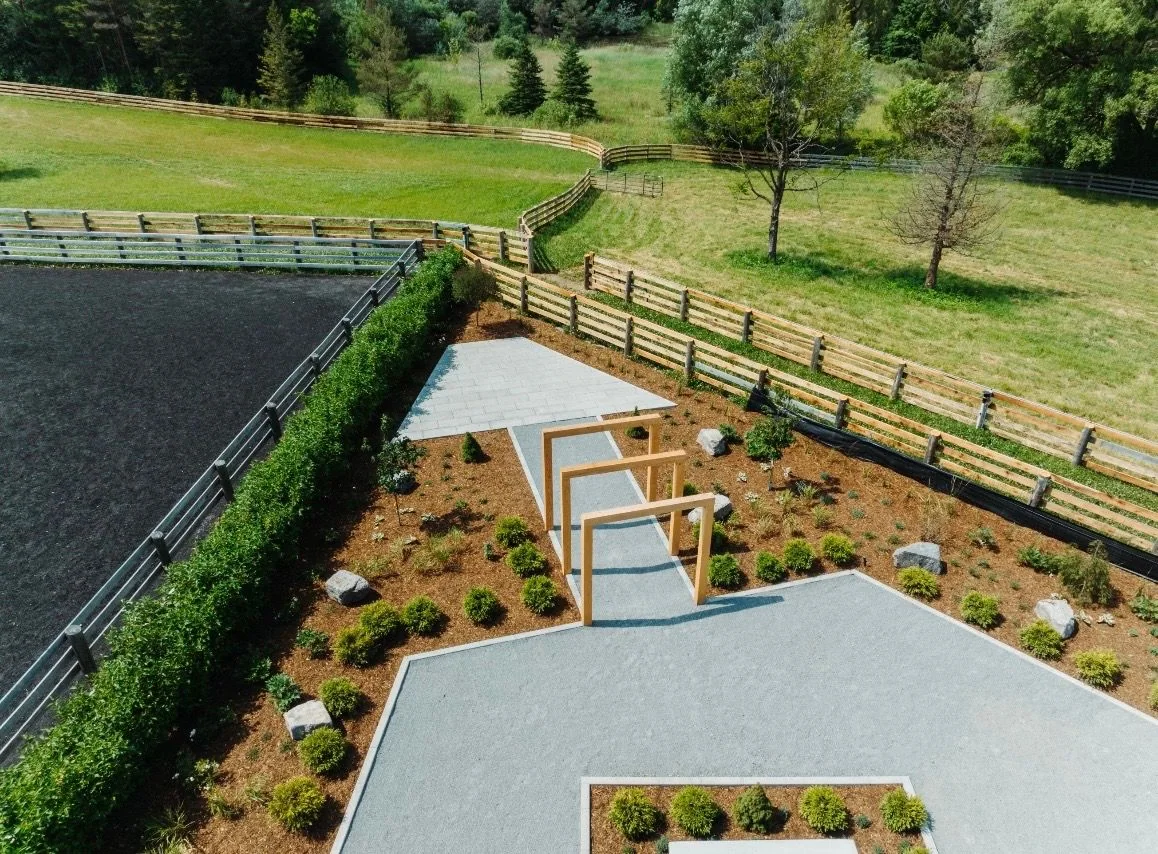 Aerial view of a large rural landscape with geometric paths and new planting