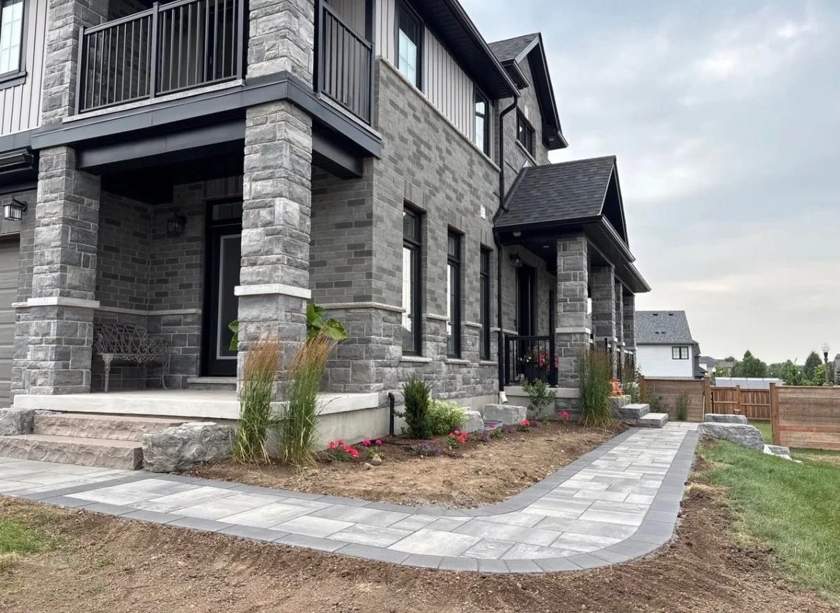 New paver walk and entrance planting during project completion