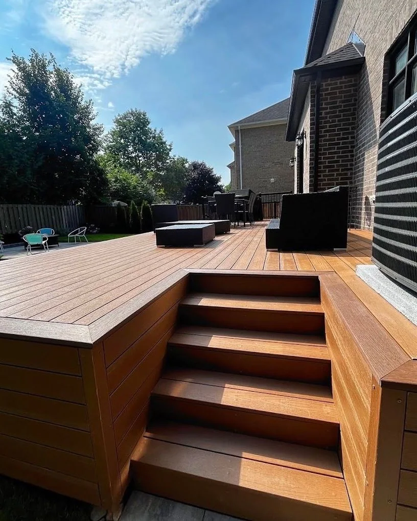 Warm composite deck with integrated steps and outdoor seating