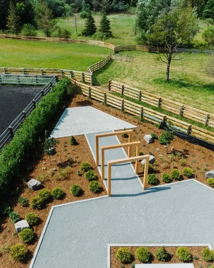 Aerial view of a large rural landscape with geometric paths and new planting