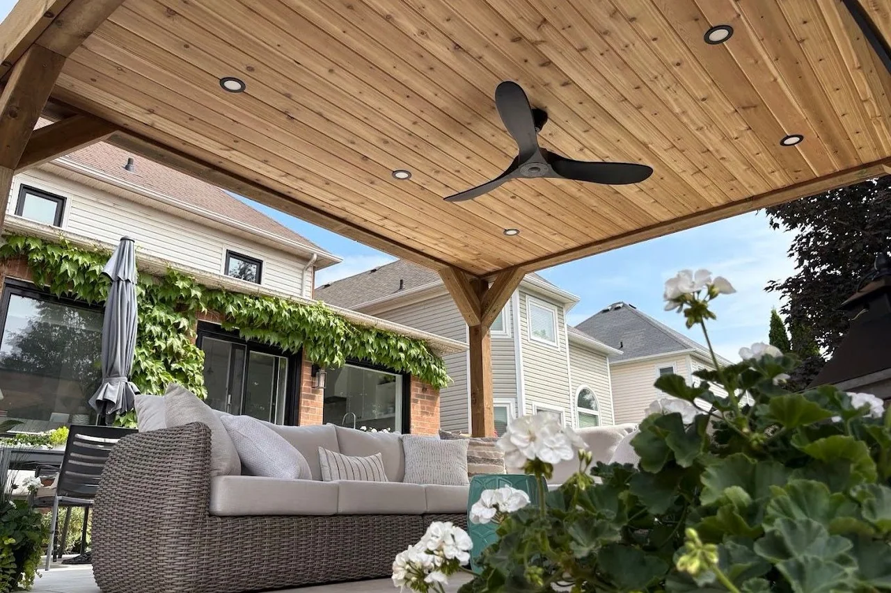 Covered timber pavilion with integrated lighting and an outdoor lounge